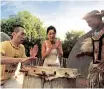  ?? ?? A COUPLE practising drumming at a cultural village in Kwazulu-natal. | South African Tourism