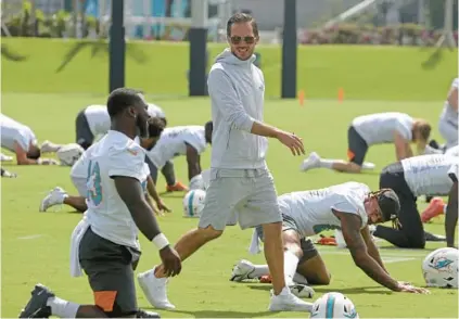  ?? SUSAN STOCKER/SOUTH FLORIDA SUN SENTINEL ?? Dolphins coach Mike McDaniel on the field during practice on June 2 in Miami Gardens.