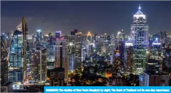  ?? AFP ?? BANGKOK: The skyline of New Town Bangkok by night. The Bank of Thailand cut its one-day repurchase rate by 25 basis points to 1.5 percent.—