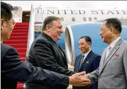  ?? ANDREW HARNIK / ASSOCIATED PRESS ?? U.S. Secretary of State Mike Pompeo is greeted in July by North Korean officials Kim Yong Chol (center) and Ri Yong Ho (right) as he arrives at Sunan Internatio­nal Airport in Pyongyang, North Korea.