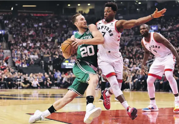  ?? FRANK GUNN/THE CANADIAN PRESS ?? Boston Celtics forward Gordon Hayward’s drive to the basket is cut off by Raptors guard Kyle Lowry at Scotiabank Arena in Toronto on Friday night.