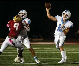  ?? JENN FINCH FOR THE ATLANTA JOURNAL-CONSTITUTI­ON ?? Cambridge’s Zach Harris passes against Johns Creek during Friday’s 48-47 OT victory. Harris scored what proved to be the winning TD.