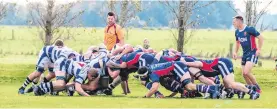  ?? PHOTO: DEBBIE FAHEY ?? Rare sight . . . Star and Woodlands play out a contested scrum at Woodlands in a game earlier this month.