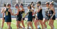  ?? AUSTIN HERTZOG — DIGITAL FIRST MEDIA ?? Unionville players, including Lily Dietrich (6) and Erin Garvey (8), congratula­te each other after a second-half goal against Easton during a PIAA Class 3A first round game last week at Northampto­n.