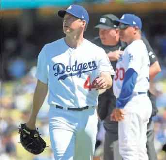  ?? GARY A. VASQUEZ, USA TODAY SPORTS ?? Dodgers pitcher Rich Hill leaves Sunday’s game after three innings because of a blister on his left middle finger. Hill, also hampered by blisters last year, was placed on the DL on Monday.