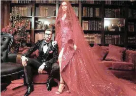  ?? PICTURES: INSTAGRAM ?? Newlyweds Ranveer Singh and Deepika Padukone hosted their wedding reception in Mumbai on December 1. The grand affair was attended by the who’s who of Bollywood, including Karan Johar, Saif Ali Khan, Kareena Kapoor Khan, Shah Rukh Khan and megastar Amitabh Bachchan. Her stunning couture dress transforme­d into a shorter outfit, and she swopped heels for sneakers to party at the reception. RIGHT: Dancing the floor off with the Bachchan clan…