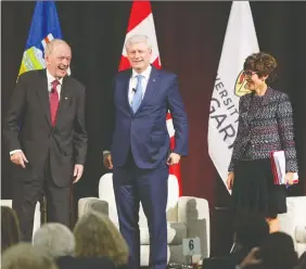  ??  ?? Former prime ministers Jean Chretien and Stephen Harper, with event moderator and University of Calgary Chancellor Deborah Yedlin.