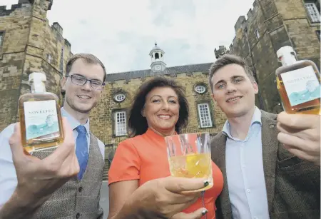  ??  ?? Vincent Efferoth and Lukas Passia with Lumley Castle’s sales director Claire Mitchell.