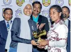  ?? ?? Top goal scorer of the tournament T. Tharanika of Mahajana College receiving the Golden Boot from Maleeka Amith, AFC Youth Ambassador for Sri Lanka and Renown women’s team player