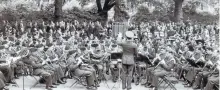  ?? SPECIAL TO THE EXAMINER ?? RCAF massed band in Lincoln’s Inn Fields, London, Harry Culley is fourth from right in second row playing clarinet.