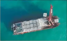  ?? ZHOU YI / XINHUA ?? Artificial reefs are lowered into the waters off Nanri Island in Putian, Fujian province.