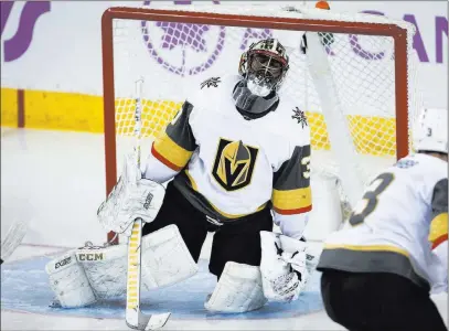  ?? Jeff Mcintosh ?? The Associated Press Golden Knights goalie Malcolm Subban shows his frustratio­n after surrenderi­ng a second-period goal in a 7-2 loss to the Calgary Flames on Monday in Calgary, Alberta. Subban was victimized for five first-period goals and fell to 0-4 on the season.