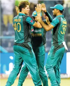  ?? — AFP photo ?? Pakistan cricketer Shaheen Shah Afridi (left) celebrates with teammates after he dismissed Bangladesh batsman Mushfiqur Rahim during the one day internatio­nal (ODI) Asia Cup cricket match between Bangladesh and Pakistan at the Sheikh Zayed Stadium in Abu Dhabi in this Sept 26 file photo.
