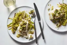  ?? ?? Roasted Fish With Leeks and Olive Salsa Verde. Christophe­r Testani, © The New York Times Co.