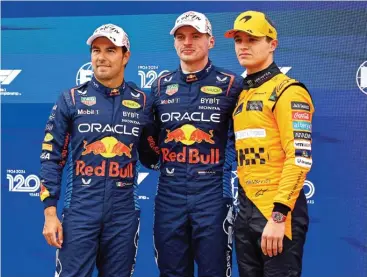  ?? ?? Max Verstappen (C) with Sergio Perez (L) and Lando Norris after qualifying first for the Japanese Grand Prix on Saturday