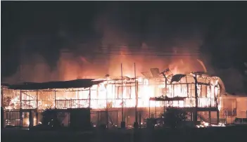  ?? ?? The health clinic at Kampung Tangkaraso­n in Beluran destroyed in an early morning fire.