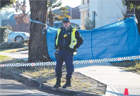  ?? Picture: DAVID SWIFT ?? HORRIFIC: The scene on St Clair Ave in St Clair in western Sydney yesterday morning where a daughter allegedly attacked and killed her mother.