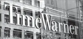  ?? Andrew Burton Getty Images ?? TIME WARNER’S expansive portfolio includes Hollywood’s largest film and television studio, Warner Bros., and such popular TV networks as HBO and CNN.