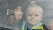  ??  ?? Jayden Sutherland, 5, waves as he catches the bus to St Andrews school after the Pareora campus of Timaru South School closed.