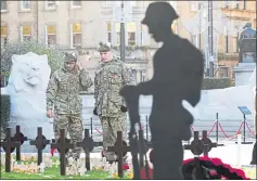  ??  ?? Army cadets at a war memorial in Glasgow’s George Square