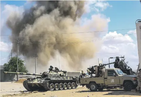  ?? AFP ?? Forces loyal to Libya’s Government of National Accord during clashes in the suburb of Wadi Rabie 30 kilometres south of Tripoli