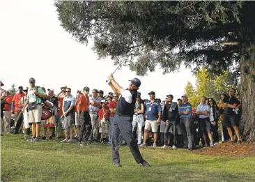  ?? EZRA SHAW/GETTY IMAGES ?? Phil Mickelson takes a swing at his second shot on the 13th hole during the opening round of the Safeway Open.