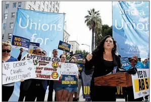  ?? AP ?? California Assemblywo­man Lorena Gonzalez speaks last month at a Sacramento rally advocating for her legislatio­n to limit companies’ ability to label workers as independen­t contractor­s. Gonzalez said in a statement Wednesday that “California is now setting the global standard for worker protection­s for other states and countries to follow.”