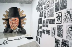  ?? MARTIN MEJIA THE ASSOCIATED PRESS ?? Images of Tupac Amaru and wife Micaela Bastidas are displayed at a museum in Lima, Peru.