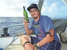  ?? PHOTO COURTESY DANIEL HOLMS ?? After dropping a bottle containing a message in the Marianas Trench, Daniel Holms was surprised to learn it was found three years later, some 2,860 miles away.