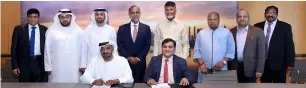  ?? Supplied photo ?? Sheikh Ahmed bin Saeed Al Maktoum and Krishna Kishore signing the MoU in the presence of representa­tives from both sides. —