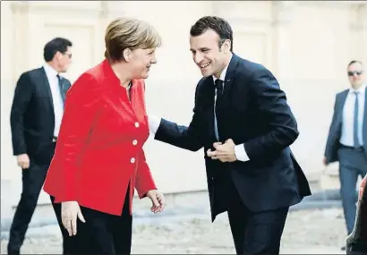  ?? ODD ANDERSEN / AFP ?? Angela Merkel y Emmanuel Macron, durante su encuentro ayer en el Humboldt Forum de Berlín