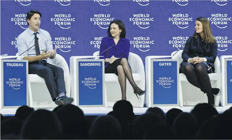  ?? MICHEL EULER / THE ASSOCIATED PRESS ?? From left, Canadian Prime Minister Justin Trudeau, Facebook executive Sheryl Sandberg and co- chair of Bill and Melinda Gates Foundation Melinda Gates, attend a panel “Progress toward Parity” in Davos, Switzerlan­d, on Friday. Trudeau challenged Davos...