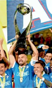  ?? AFP ?? Millonario­s players celebrate after winning their Colombian Football League final against Santa Fe at Nemesio Camacho El Campin Stadium in Bogota on Monday.