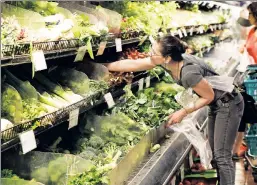  ??  ?? Plenty of fresh scandals: Shoppers at the embattled Park Slope Food Coop.