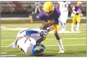  ?? (Arkansas Democrat-Gazette/Justin Cunningham) ?? North Little Rock’s Ricky Reed (left) intercepts a pass meant for Little Rock Catholic’s Kennedy
Washington (right).