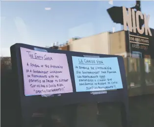  ?? ALLEN MCINNIS ?? Rob Callard, the owner of Chez Nick, is protesting government restaurant closures by placing an empty chair outside his restaurant. “It crosses my mind every day that I should just open the doors and let people in, respecting the original set of guidelines they gave us.”