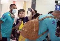  ?? (AFP) ?? Football players Dani Alves (L) and Richarliso­n of Brazil when they arrived with the team for the Tokyo 2020 Olympic Games at Narita Internatio­nal Airport in Narita, Chiba prefecture on July 17th.