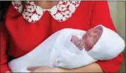  ?? JOHN STILLWELL — POOL PHOTO (VIA AP) ?? Kate, Duchess of Cambridge, holds her newborn son Monday in London.