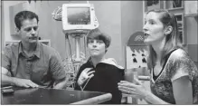  ?? STEVE BOSCH/ PNG ?? Colton Boechler talks about being saved by a defibrilla­tor applied by two lifeguards at UBC. He is flanked by his father Kelly and mother Julie at B. C. Children’s Hospital in Vancouver.