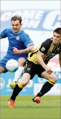  ??  ?? THAT’S MINE! Stockport scorer Danny Lloyd challenges for possession