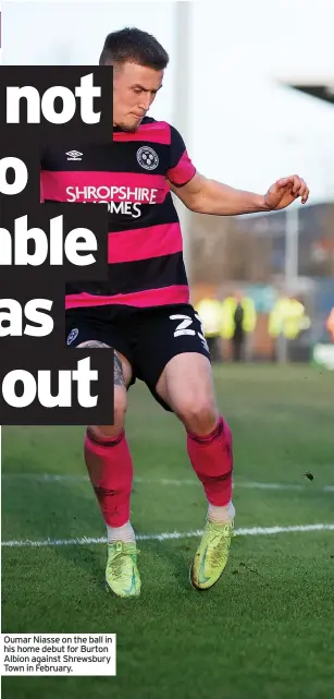  ?? ?? Oumar Niasse on the ball in his home debut for Burton Albion against Shrewsbury Town in February.