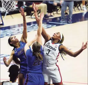  ?? David Butler II / Associated Press ?? UConn’s Aaliyah Edwards (3) battles for a rebound against DePaul’s Sonya Morris during the first half Tuesday in Storrs.