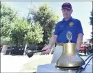  ?? WILL LESTER — STAFF PHOTOGRAPH­ER ?? Redlands Sunrise Rotary member Chris Martin tolls the bell 20 times during Saturday’s memorial tribute in Redlands for the victims of 9 /11. Several communitie­s held similar gatherings in the region.
