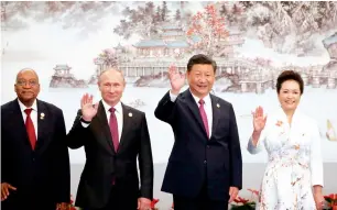  ??  ?? South African President Jacob Zuma, Russian President Vladimir Putin, Chinese President Xi Jinping and his wife Peng Liyuan at the Brics Summit in Xiamen on Monday.