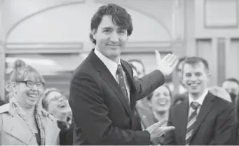  ?? ADRIAN WYLD/ THE CANADIAN PRESS ?? Trudeau gestures for media to leave so he can begin his first caucus meeting as Liberal leader on Wednesday.