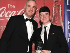  ??  ?? Paul McDonnell from Coca Cola Internatio­nal Services presents the June award to Dylan Keating.