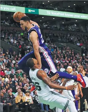  ?? BOB DECHIARA / USA TODAY SPORTS ?? Philadelph­ia 76ers’ Ben Simmons is fouled by Boston Celtics’ Marcus Smart during the second half of Thursday’s NBA clash at TD Garden in Boston. The Celtics won 108-97 to improve to a league-best 19-4 on the season.