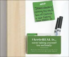  ?? Aerie ?? Sticky notes with positive affirmatio­ns penned by customers decorate the mirror of a fitting room inside an Aerie store.