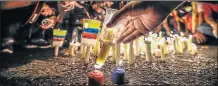  ?? Picture: AFP ?? ENOUGH IS ENOUGH: Opposition activists place candles to protest against the deaths of 43 people in clashes with the police during weeks of demonstrat­ions against the government of Venezuelan President Nicolas Maduro