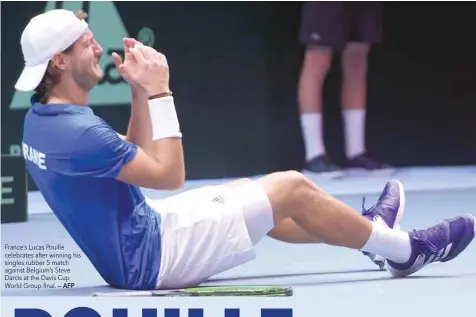  ?? — AFP ?? France’s Lucas Pouille celebrates after winning his singles rubber 5 match against Belgium’s Steve Darcis at the Davis Cup World Group final.